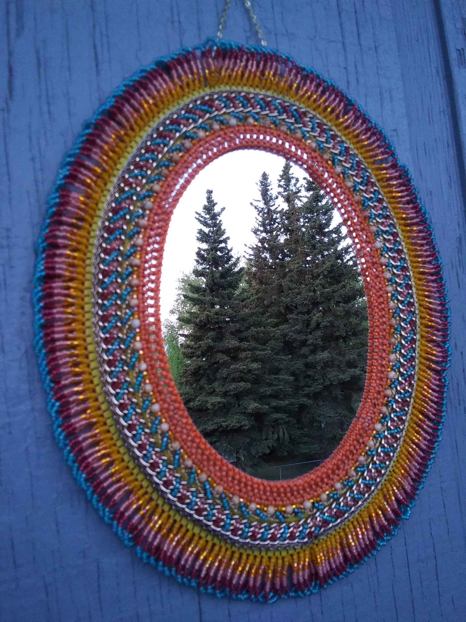 Finished wall mirror with jewelry chain as an embroidery material