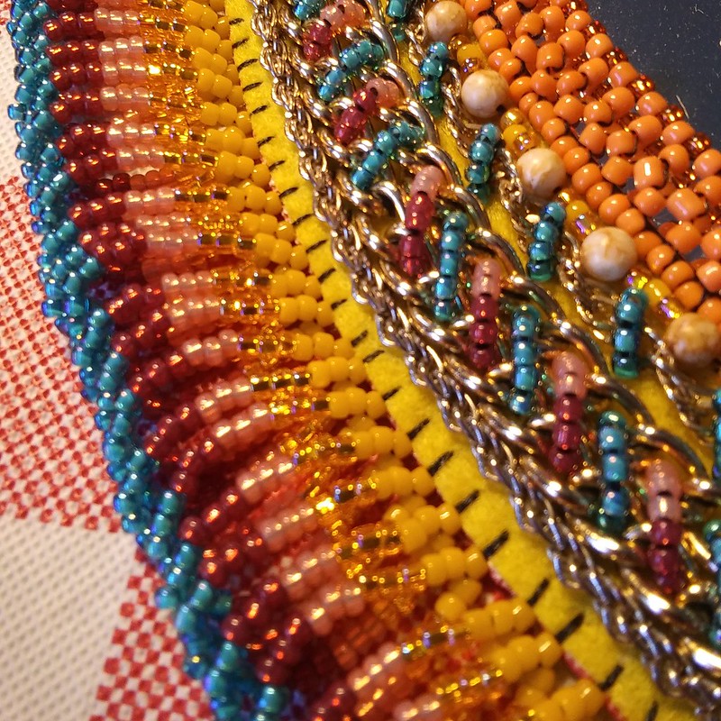 jewelry chain as an embroidery material detail